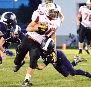 football Jake Pickel finds his way through a cloud of blue