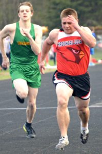 Dylan Kubly pushes hard during qualifying rounds to qualify for the 100 Meter Dash Finals