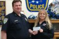 SUBMITTED PHOTO The Independent-Register
Brodhead Police Chief Chris Hughes receives a check this past
week from fund-raising and donations to pay for a new K9 squad car.
Making the presentation is President of the local Police Association
(and dispatcher) Mary Wells.