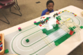 DAN MOELLER PHOTO Independent Register
Brodhead Public Library
	Declan, 6, enjoys playing with one of the Lego tracks at the Brodhead public library last Thursday.