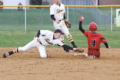 BECKY MALKOW Independent-Register
Chase Harnack slides safely into second for a stolen base in the top of the 7th last Thursday night. The Cardinals tried to put together a late game rally, but fell short.