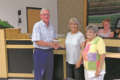 JEREMY GOKEY PHOTO Independent Register
Mayor Doug Pinnow accepts a check from Brod-head Garden Club representatives Diane Anderson and Joyce Nipple to use toward replanting trees in the city parks.