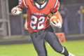 MANDY FIELDS PHOTO Independent Register
Nick Naramore breaks tackles to move the ball up field for a Cardinal first down.