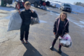 PHOTO SUBMITTED The Independent-Register
	Finley Riese, left, and Easton Riese help load and unload items donated for a textile drive to benefit Al-brecht Elementary School, where they are students and their mom, Lori Riese, is a third-grade teacher.