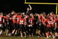 BECY MALKOW Brodhead Independent Register
	The Cardinals players lift head coach, Jim Matthys, in victory after earning their fourth win on the season last Friday.