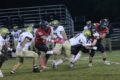 Austin Moe snatches the ball as Blake Matthys pulls Watertown Luther Prep's quarterback to the ground for the first turnover of the game